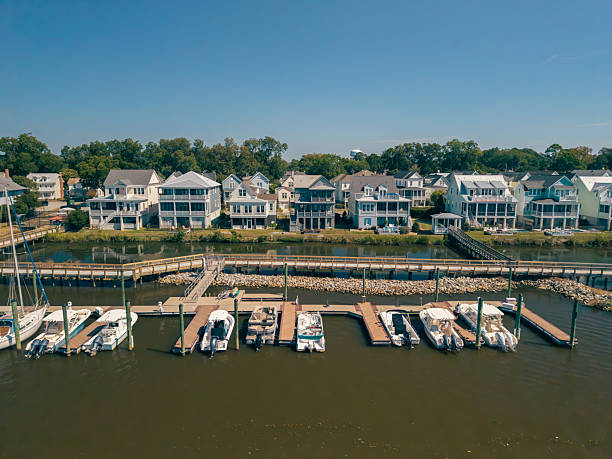 istock New Water Front Coastal Homes - Dock Boats and Boardwalk 2237742281