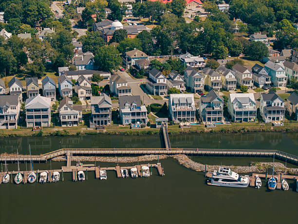 istock New Water Front Coastal Homes - Dock Boats and Boardwalk 2237742325