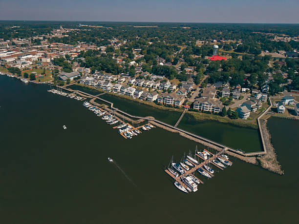 istock New Water Front Coastal Homes - Dock Boats and Boardwalk 2237742463