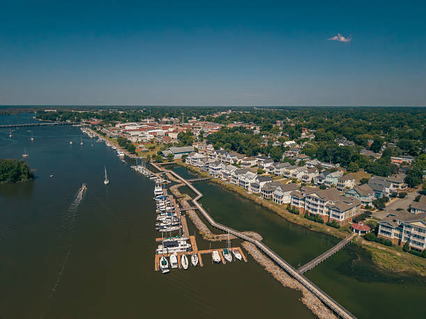 istock New Water Front Coastal Homes - Dock Boats and Boardwalk 2237742492