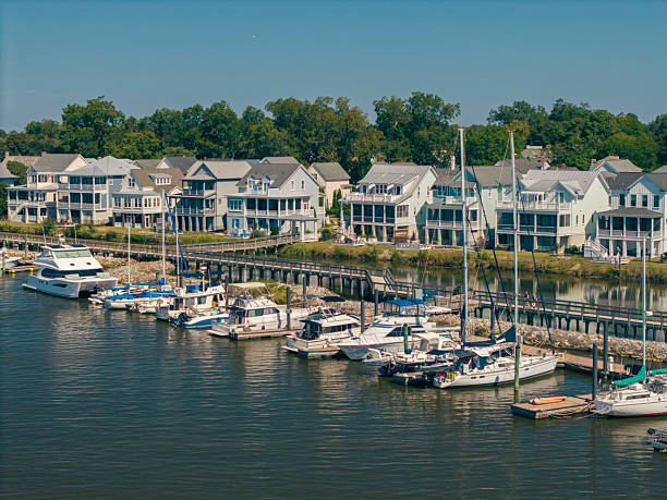 istock New Water Front Coastal Homes - Dock Boats and Boardwalk 2237742571