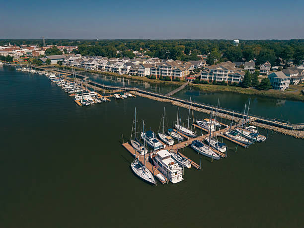 istock New Water Front Coastal Homes - Dock Boats and Boardwalk 2237743787