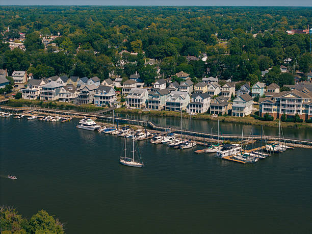 istock New Water Front Coastal Homes - Dock Boats and Boardwalk 2237743830