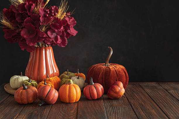istock Autumnal composition of decorative mini pumpkins on a wooden surface. 2237745809