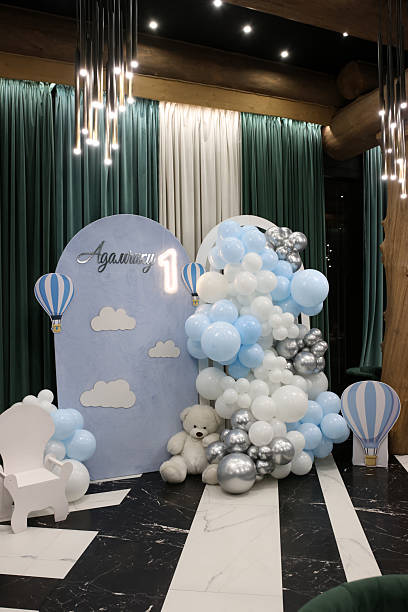 istock Decoration with blue and white balloons, teddy bear and number 1 for celebrating a first birthday party. 2237747113