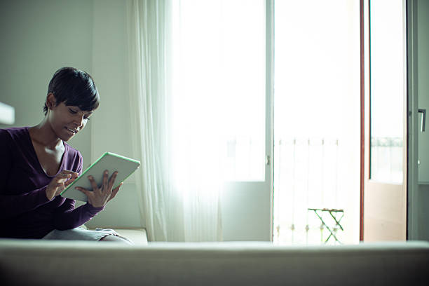 istock Black Woman Using Digital Tablet Indoors 2237750482