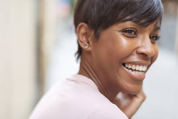 istock Smiling Black Woman Outdoors on a Sunny Day 2237750643