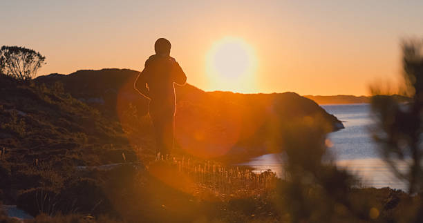 istock Lone Hiker Exploring Rocky Nordic Landscape at Sunset 2237752870