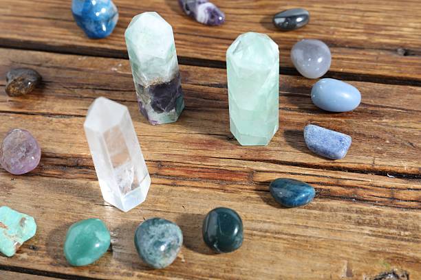 istock Different healing stones on wooden table, closeup 2237757146