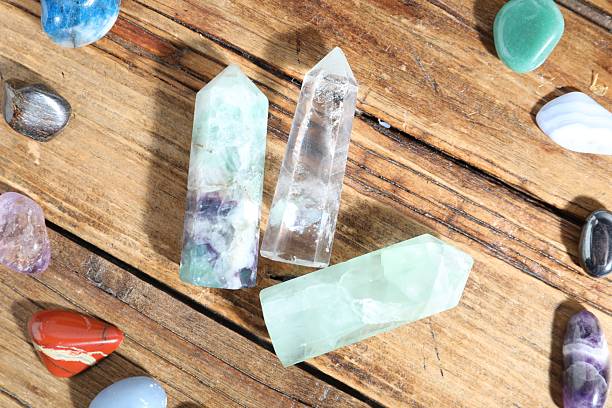 istock Different healing stones on wooden table, flat lay 2237757172
