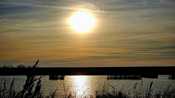 istock Golden Sunset Over Tranquil Lake 2237761162