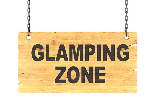 Glamping Zone wooden signboard hanging on chains. 3D rendering isolated on white background