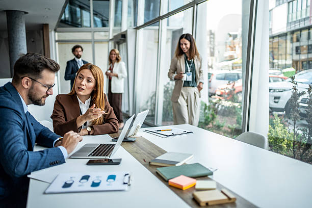 istock Business professionals discussing project during meeting in modern office 2237761602