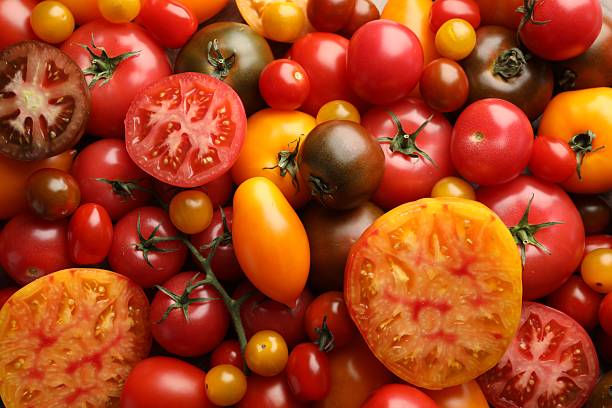 istock Different ripe juicy tomatoes as background, closeup 2237761844