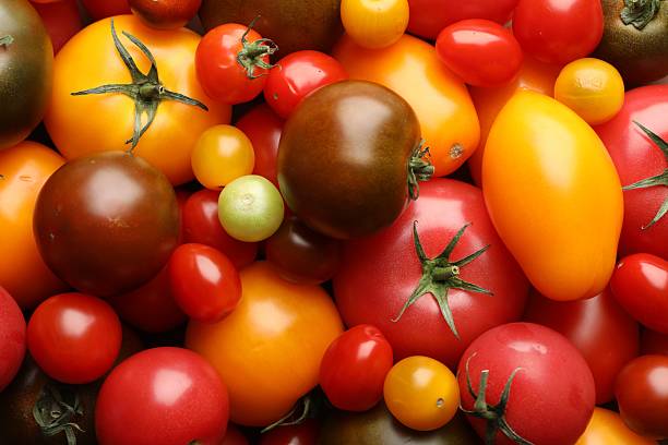 istock Different ripe juicy tomatoes as background, closeup 2237761876