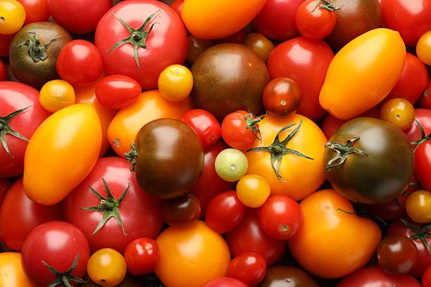 istock Different ripe juicy tomatoes as background, closeup 2237761878
