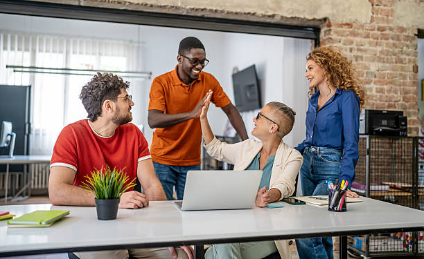 istock Diverse startup team celebrating success with high five 2237762800