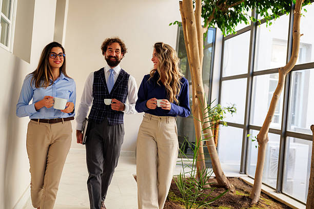 istock Business people walking and talking during coffee break 2237765627