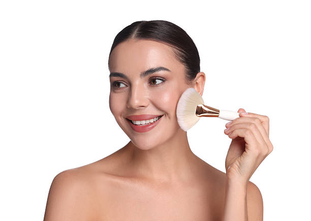 istock Beautiful woman applying makeup with brush on white background 2237765972