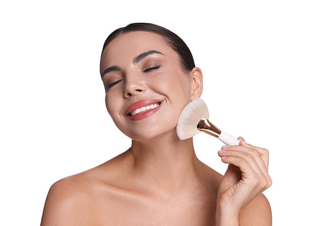 istock Beautiful woman applying makeup with brush on white background 2237765987