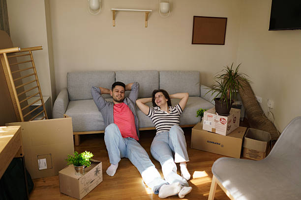 istock Happy couple relaxing after moving into their new home. 2237777501