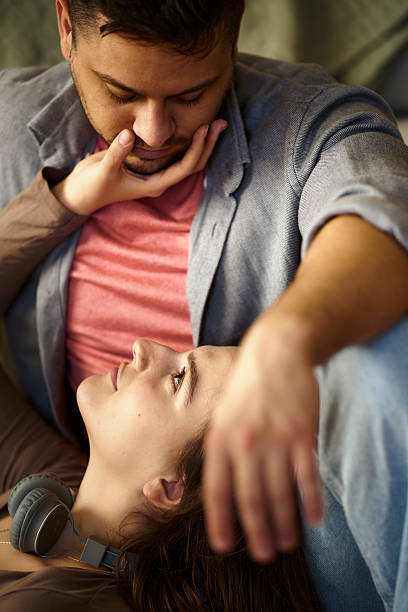 One Caucasian Fashionable Couple Isolated Over White Studio Backgdrop While Posing in Basic Minimal Unisex Clothing As Concept of Relations, Fashion, Beauty, Love.Horizontal Image