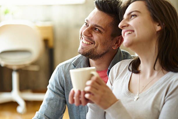 istock Happy couple enjoying coffee and conversation together. 2237777601