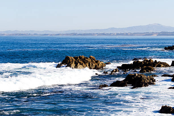 Ocean Waves Crashing On Rocks Monterey Bay Pacific Grove California With Haze
