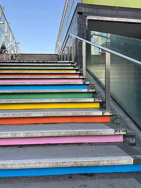 istock Image of rainbow colour steps on concrete staircase outdoors, painted in bright sunny colours, vibrant stairs 2237785334