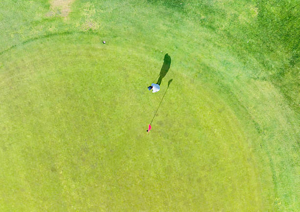 istock Aerial view of golf course featuring golfer. 2237788882