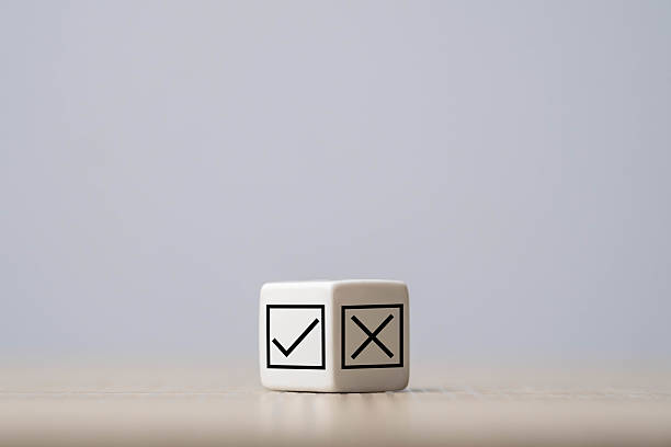 istock A cube with check and cross symbols sits on a neutral surface, symbolizing choice and decision-making. 2237792392