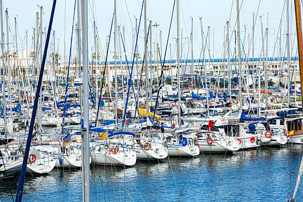 Travel destination: Sailboats docked in a harbor on a sunny and beautiful day.