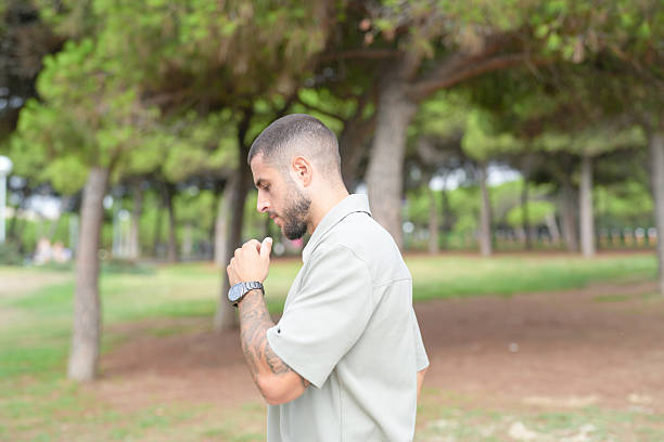istock A man with a watch on his wrist stands in a park 2237802742
