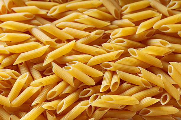 istock Uncooked Ridged Penne Pasta Made from Durum Wheat Macro Shot 2237803696
