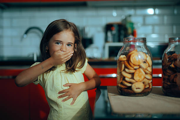 istock Child Feeling Full After Eating Many Cookies 2237807373