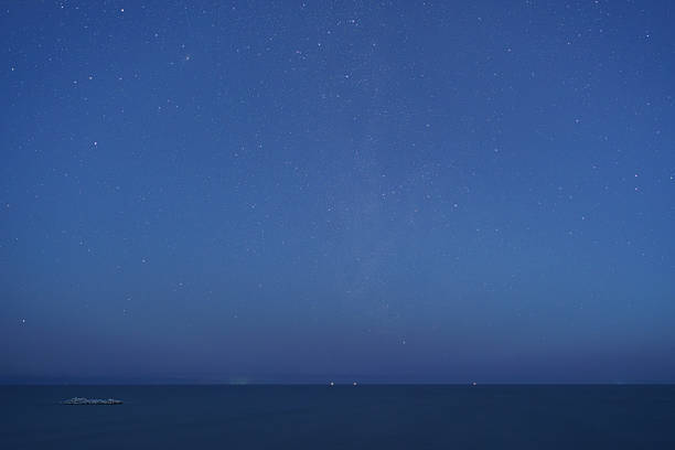 istock Starry sky and sea at dawn 2237808406