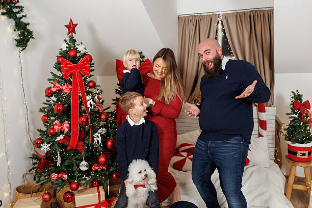 istock Cheerful family having fun while making faces  during Christmas holidays at home 2237813266