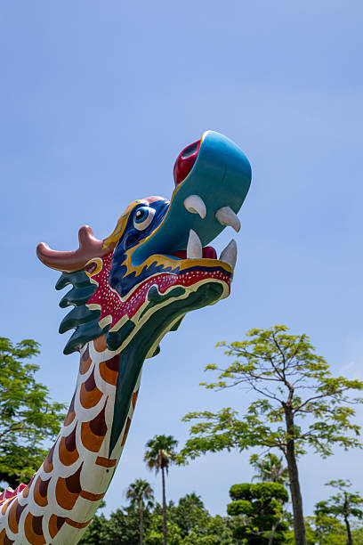 istock Vividly Colored Dragon Sculpture Under a Clear Blue Sky 2237814759
