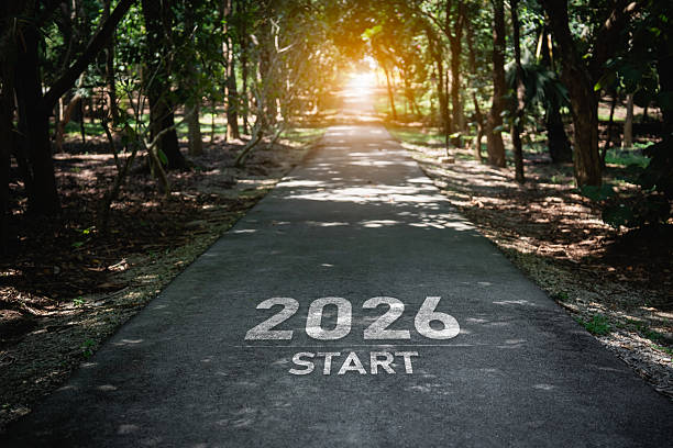 istock Inspirational Path with '2026 Start' Marking on Road Surrounded by Green Trees, Symbolizing Journey and Future Opportunities in Nature 2237815432