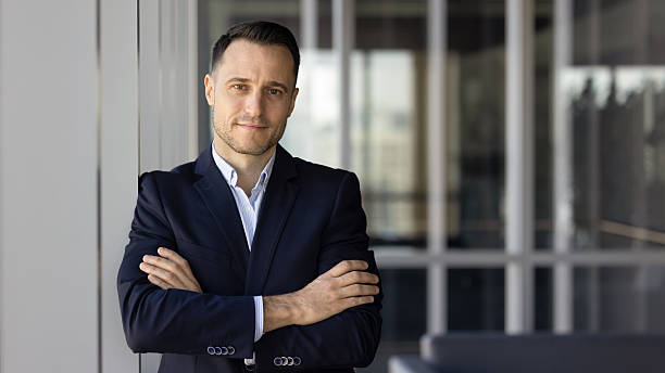 istock Middle aged businessman posing in modern workplace 2237815612