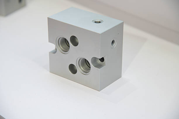 Aluminum hydraulic manifold connecting fluid lines and components in industrial machinery