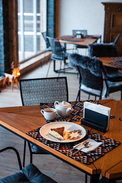 Cozy Cafe with Cake and Tea on Wooden Table