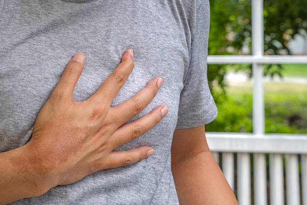 istock Man clutching chest suggests heart-related pain or breathing difficulty. 2237824710