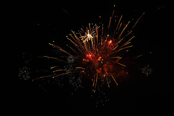 istock Colorful Fireworks Explosion in the Night Sky - Gold and Red 2237833612