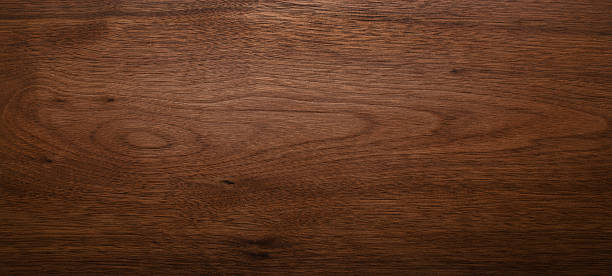istock Wide format black walnut natural texture desktop background. Walnut wood texture background. 2237834644