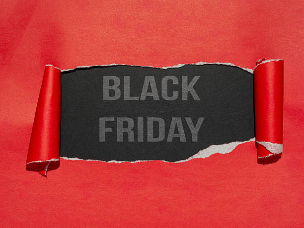 istock A red paper that has been torn to reveal a dark surface, displaying the text Black Friday. 2237836193