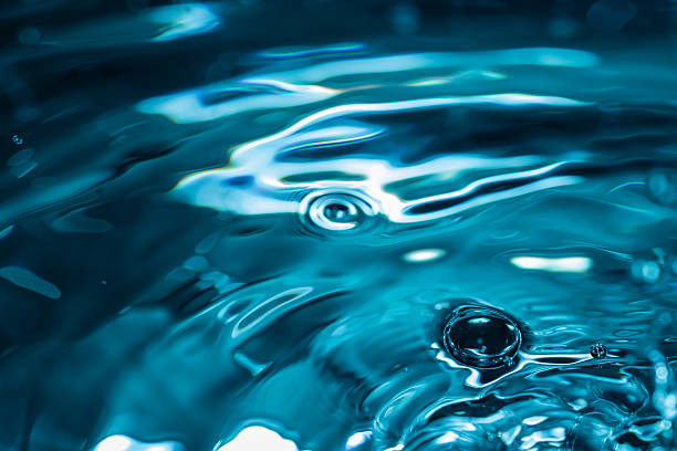 istock 354.Bubble and Ripples on Vibrant Blue Water Surface 2237836223