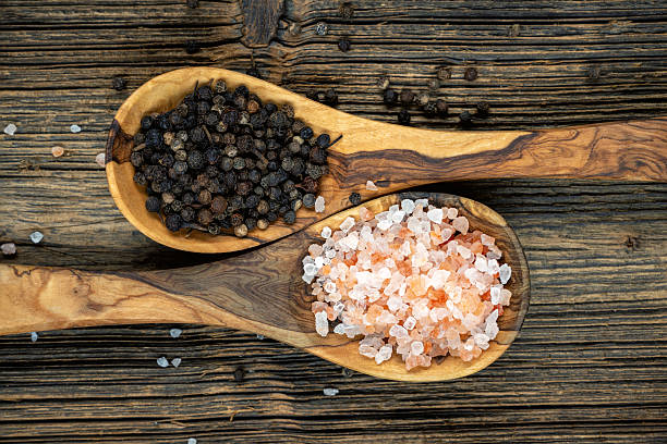 istock Himalayan salt and pepper on olive wood cooking spoons 2237836301