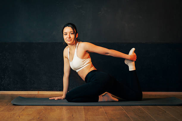 istock Fit Yoga Pose In Gym: Athlete On Mat Demonstrating Stretch And Balance 2237841754
