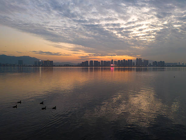 City Silhouette at Sunset by the Lake